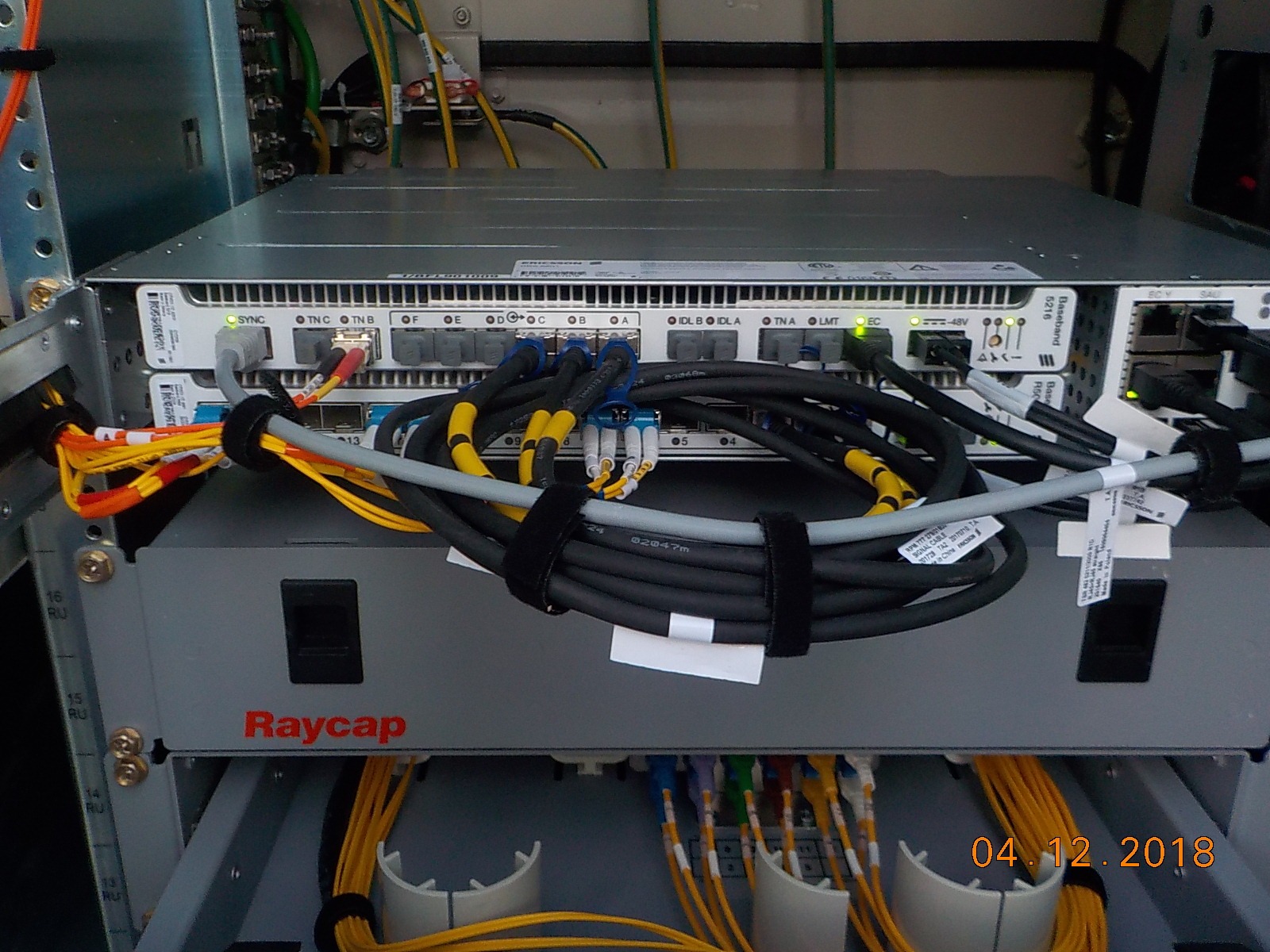 Connected Ericsson baseband and neatly dressed fiber cabling after Bellevue site corrections