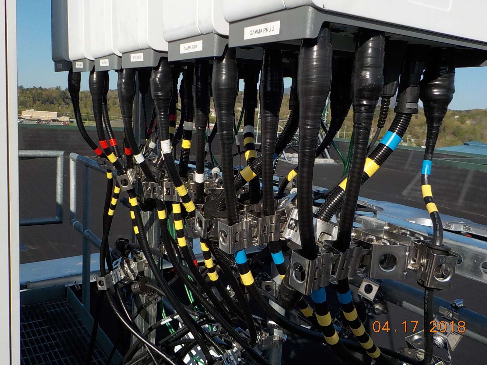 Labeled Henderson Springs RRU units and color-coded RF jumper connections